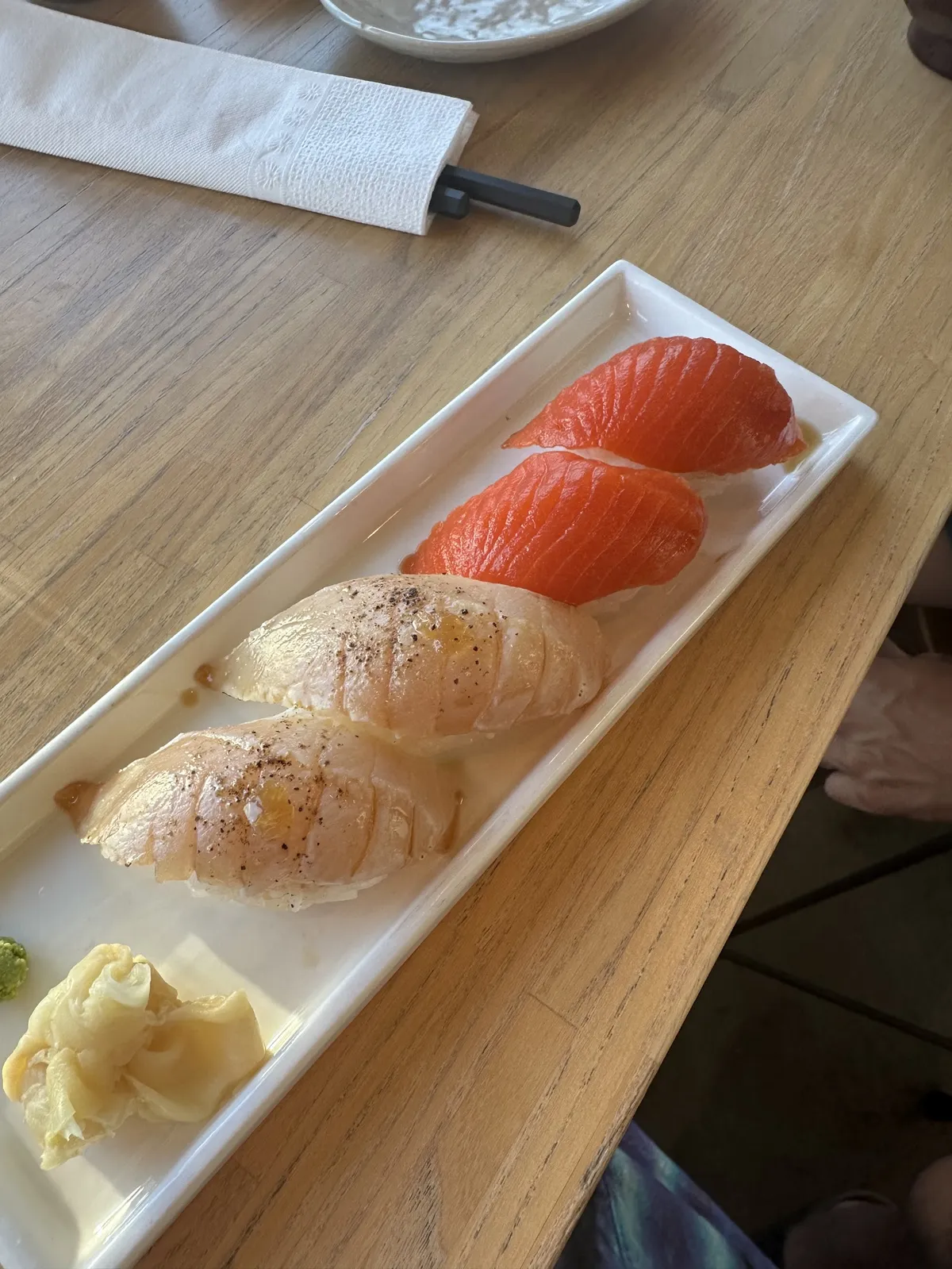 Plate of salmon and white fish nigiri sushi